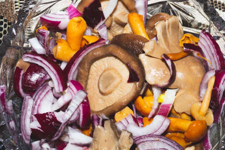 Marinated mushrooms with fresh onion in a bowl. pickled appetizerの写真素材