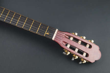 Guitar fretboard close up. musical instrument. strings on the guitar neck. copy spaceの写真素材