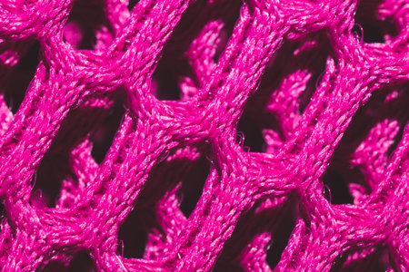 Pink fabric texture macro. abstract knitted pattern. woven material. textile background