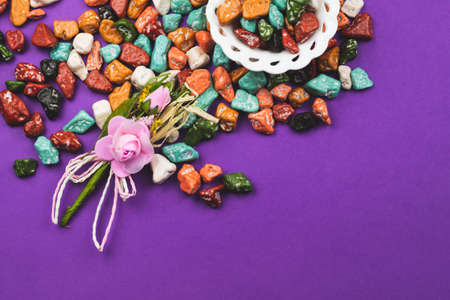 Festive decoration. lollipops and candy pebbles. sweets in the form of colored stones. colored background with colorful candies. copy spaceの写真素材