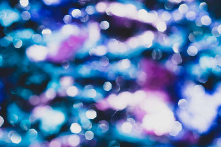 Blue festive background with bokeh lights. blurred lights glowingの写真素材