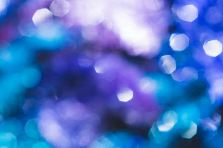 Blue festive background with bokeh lights. blurred lights glowingの写真素材