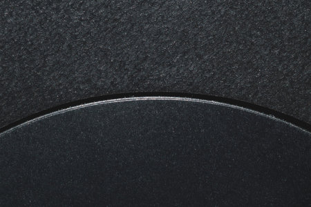 Black background with a curved slit. plastic texture macroの写真素材