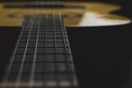 Acoustic guitar close up. musical instrument. strings on the guitar fretboardの写真素材
