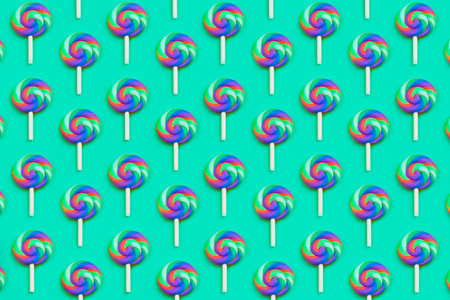 Lollipops are in a row. spiral candy pattern. lots of sweets on a turquoise background. festive...