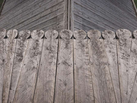 Carved wooden planks background. detail of the traditional roof of a village houseの写真素材