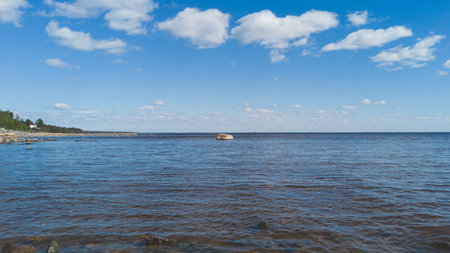 Shore of the sea. seascape with horizon line. sky with clouds. water surface
