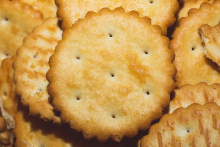Round crackers background. crispy cookies. pile of biscuits