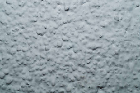 Uneven wall. painted concrete texture. rough surfaceの写真素材
