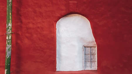 Unusual window of old house. vintage architecture. exterior of ancient buildingの写真素材