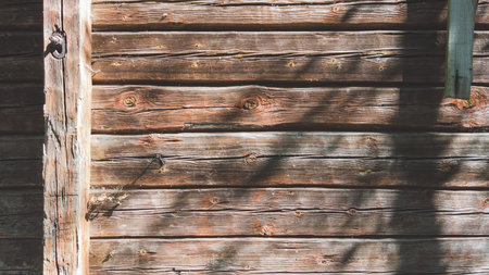 Wooden wall of log cabin. wood background. square timber. facade of wooden houseの写真素材