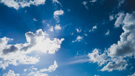 Blue sky with white clouds background. sunny weatherの写真素材
