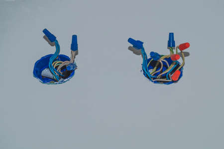 Unfinished electrical socket with electrical wires and connectors. renovation processの写真素材