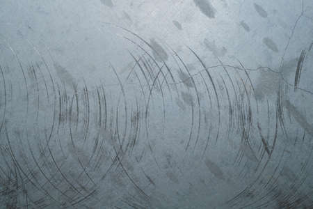 Concrete wall with cracks and scratches. abstract gray background with patterns. wall is ready for renovation worksの写真素材