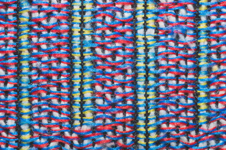 Colorful knitted wool background. woolen fibers close up