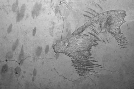 Concrete wall with cracks and scratches. abstract gray background with patterns. wall is ready for renovation worksの写真素材