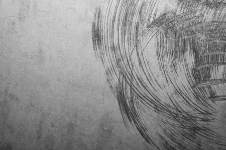 Concrete wall with cracks and scratches. abstract gray background with patterns. wall is ready for renovation worksの写真素材