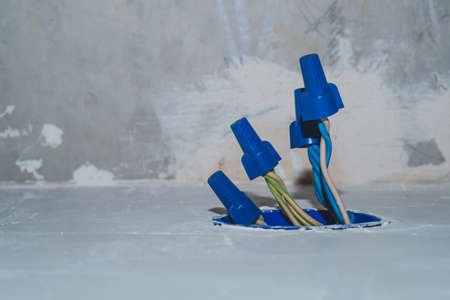 Unfinished electrical socket with electrical wires and connectors. renovation processの写真素材