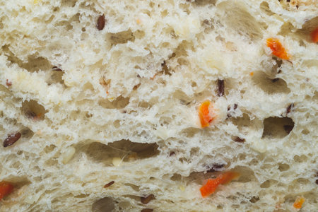 Slice of bread with seeds close up background