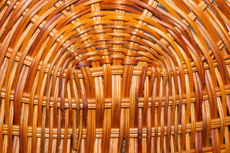Wooden wicker straw background. woven surface of handcrafted basket close up
