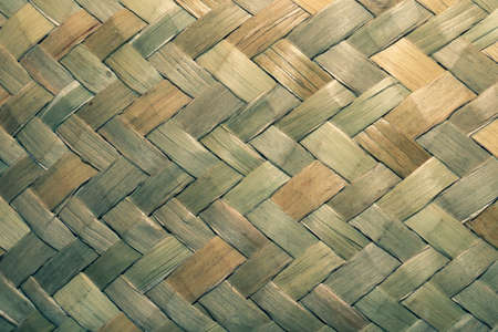 Detail of wicker basket surface close up. wooden backgroundの写真素材