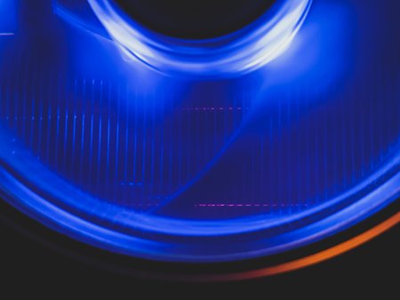 Computer cooling fan with blue light abstract background. cooler in action with led close up. power in motion conceptの写真素材
