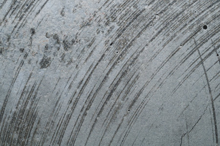 Concrete wall with cracks and scratches. abstract gray background with patterns. wall is ready for renovation worksの写真素材