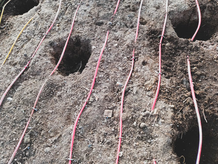 Holes in the soil for planting plants. gardening worksの写真素材