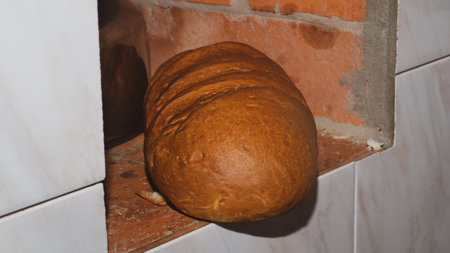 Long loaf in the ordinary stone stove close upの写真素材