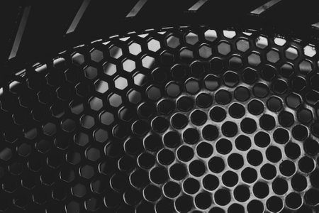 Grid with round holes abstract background. protective mesh of computer cooling systemの写真素材
