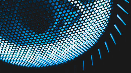 Detail of computer fan with blue color light abstract background. cooler grid close up. rgb led illuminationの写真素材