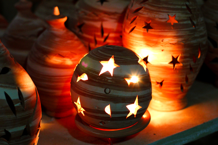Clay lantern shining in the darkの写真素材