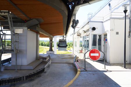 cableway cabin close-up. In the foreground, a STOP sign prohibiting traffic. Transportation of people by cable carの写真素材