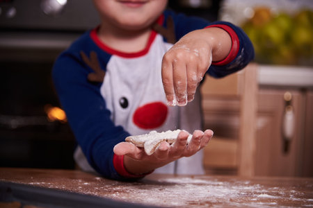 Babys hands close up with homemade cookies