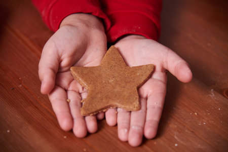 Babys hands close up with homemade cookies