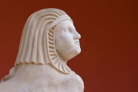 Ancient Statue on Red Backgroundの写真素材