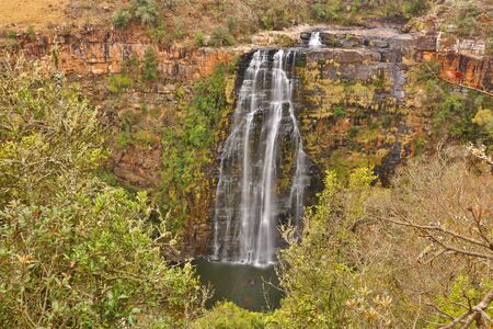 Stunning view of Lisbon Falls at Blyde River (Mpumalanga Province, South Africa). Majestic waterfall sourrounded by beautiful nature. Photo taken with long exposure for a smooth waters movement.の写真素材