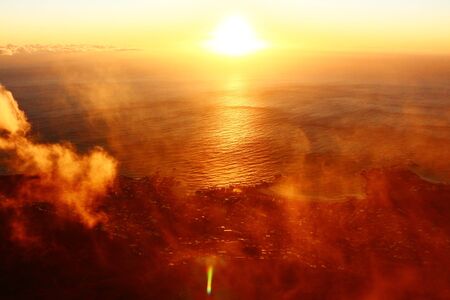 Magic Sunset in the clouds over the oceanの写真素材