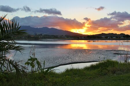 Beautiful Sunset over a lake and mountain in New Zealandの写真素材