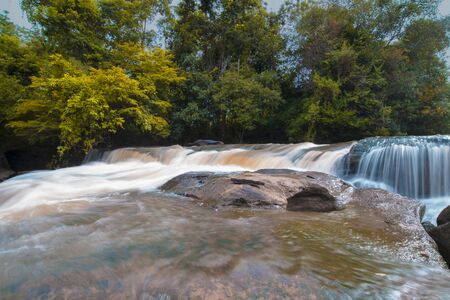 Waterfalls in tropical forests, Water from the creek flows onto the rocks, Cause a beautiful waterfall.の写真素材