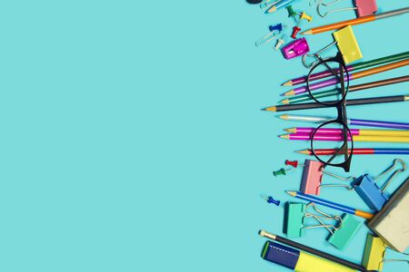 Stationary supplies placed on blue background, Back to school concept, Copy-spaceの写真素材