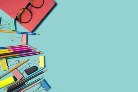 Stationary supplies placed on blue background, Back to school concept, Copy-spaceの写真素材