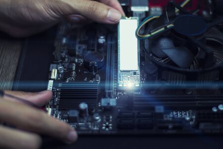 Technology to speed up computer, Experts are installing speed devices on motherboard, Close-upの写真素材