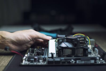 Technology to speed up computer, Experts are installing speed devices on motherboard, Close-upの写真素材