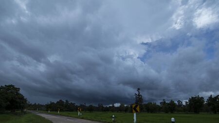 Rainy season sky, Sky is overcast when the rain is coming around farm.の写真素材