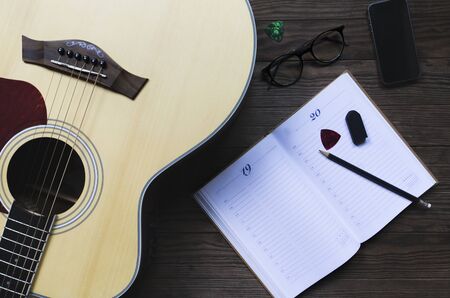 Composer's equipment is placed on wooden table, Close-up, Copy-space.の写真素材