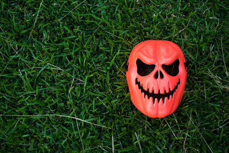 Devil mask placed on the lawn, Copy-space