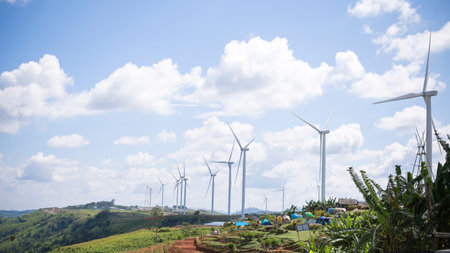 Energy for environment, Wind turbine built on mountain, Clear sky during the day time.