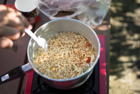 Cooking during the camping, Instant noodles, simple food anywhere, anytimeの写真素材