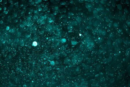 Dark blue bokeh, Photos caused by water droplets, Festival background.の写真素材
